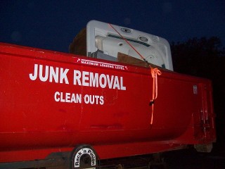 Truck with text on side, "Junk removal, clean outs"