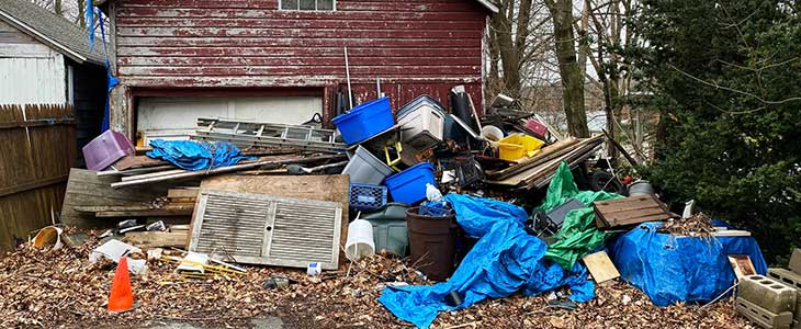 Pile of garbage by shed