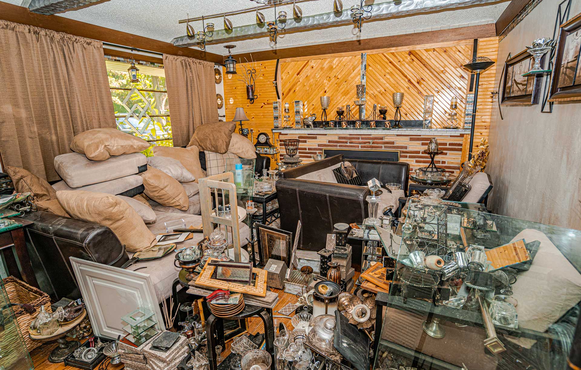 Den in hoarder's home, piled high with junk